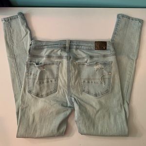 Light wash destroyed AEO jeans